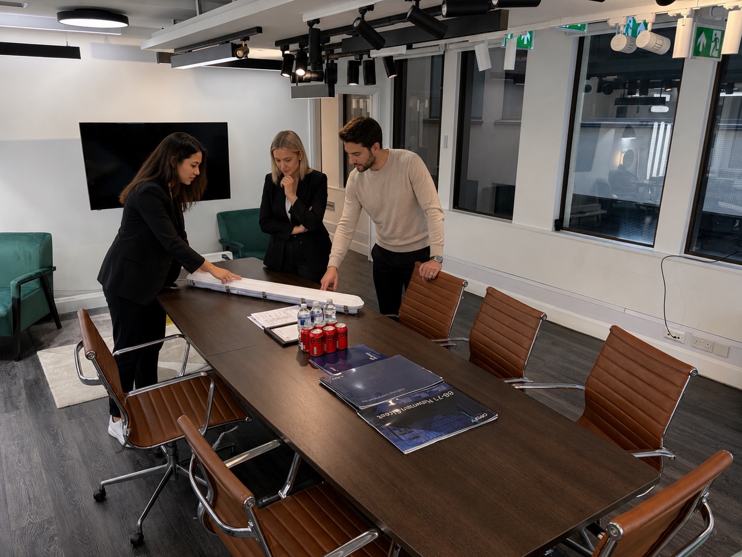 Orlight team reviewing a luminaire in the design meeting room